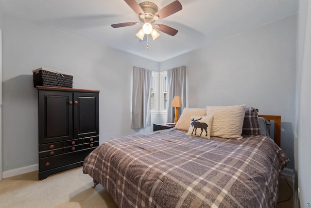 bedroom featuring light colored carpet and ceiling fan