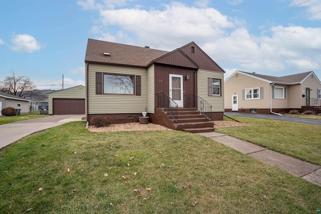 view of front of house featuring a garage and a front lawn