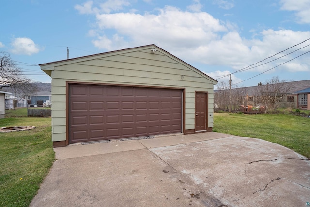 garage featuring a lawn