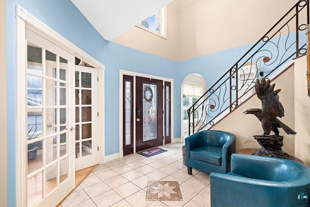 tiled entryway featuring french doors