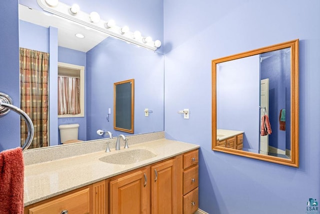 bathroom with vanity and toilet