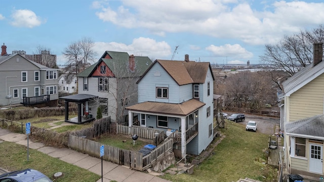 view of front of property with a front yard and a porch