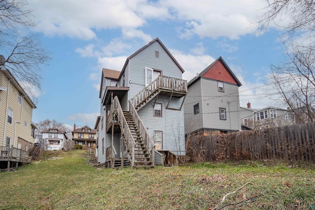 back of house with a yard