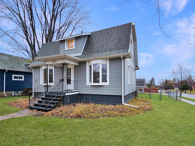 bungalow-style house featuring a front lawn