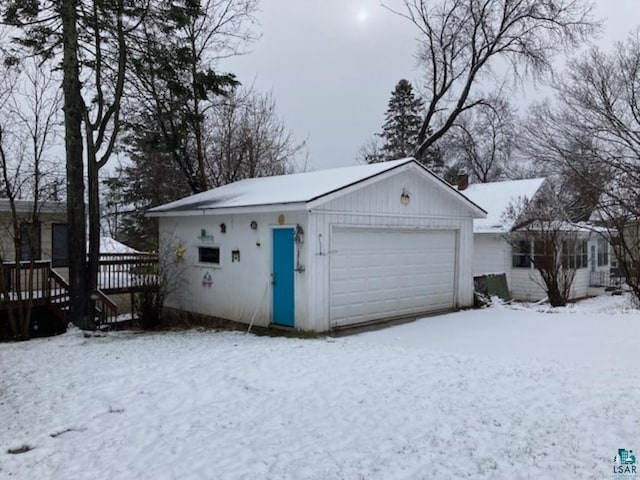 view of snow covered garage