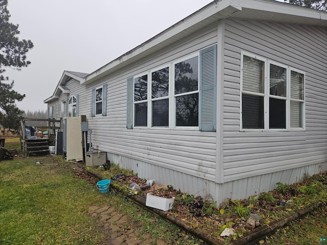 view of property exterior with a yard