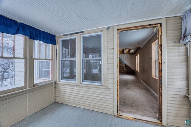 unfurnished sunroom featuring a wealth of natural light