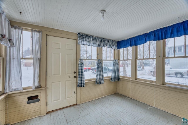 unfurnished sunroom with plenty of natural light