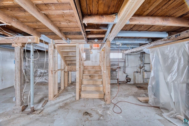 basement with wood ceiling and sink