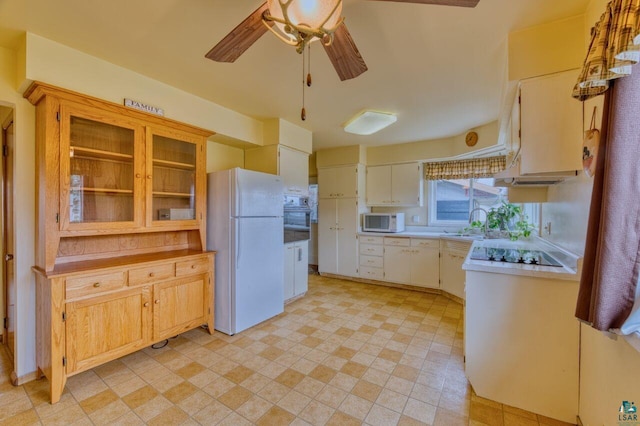 kitchen with ceiling fan, white appliances, and sink