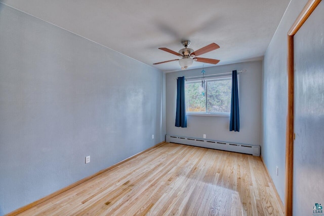 unfurnished room with ceiling fan, baseboard heating, and light hardwood / wood-style flooring