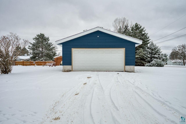 view of snow covered garage