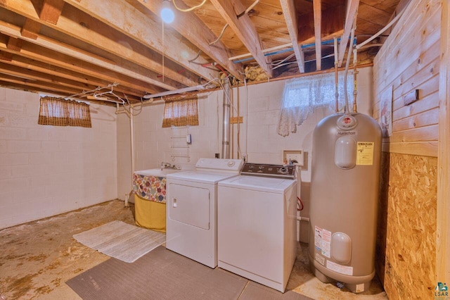 washroom with washer and clothes dryer and water heater