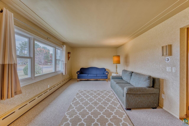 carpeted living room featuring a baseboard heating unit