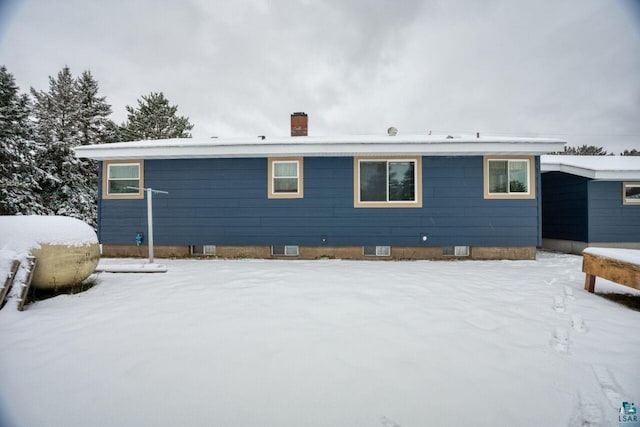 view of snow covered property