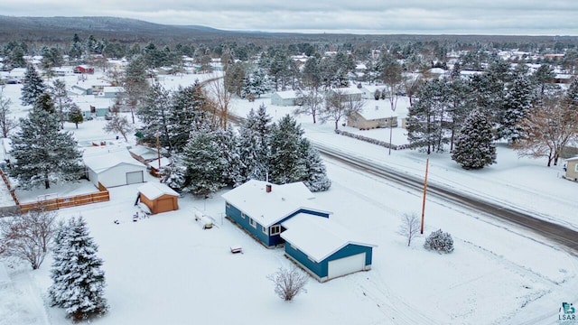 snowy aerial view with a mountain view