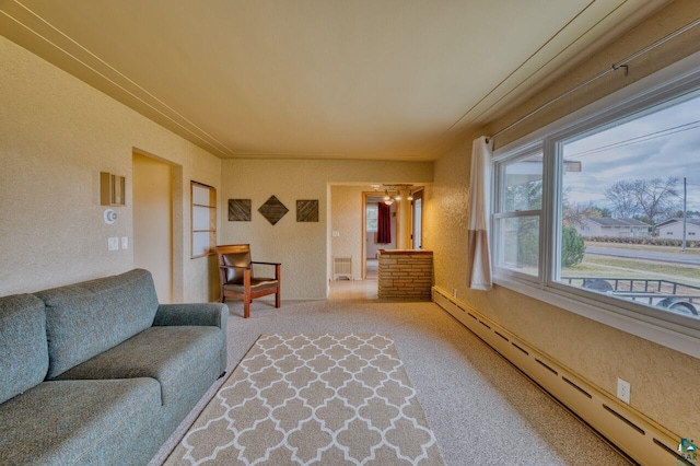 living room featuring carpet floors and a baseboard radiator