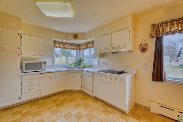 kitchen with white cabinetry, white appliances, sink, and a baseboard heating unit