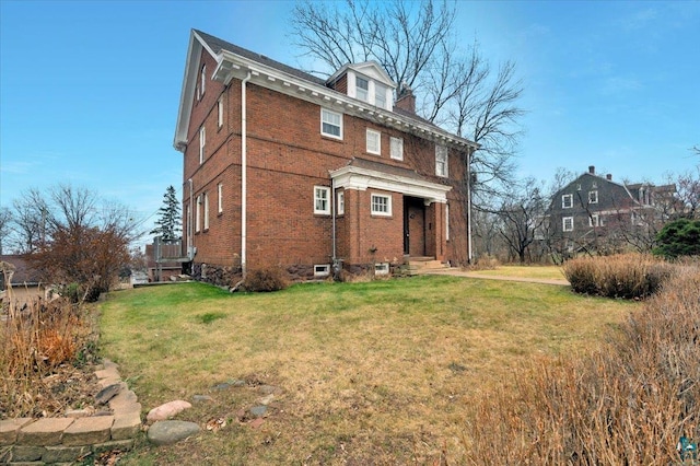 back of house featuring a yard