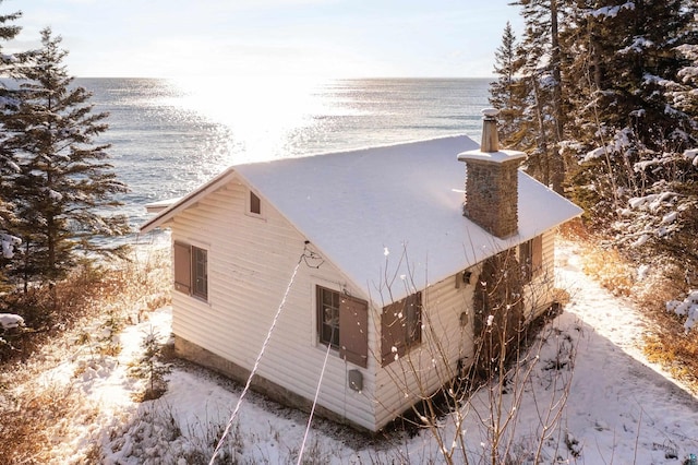 view of side of property with a water view