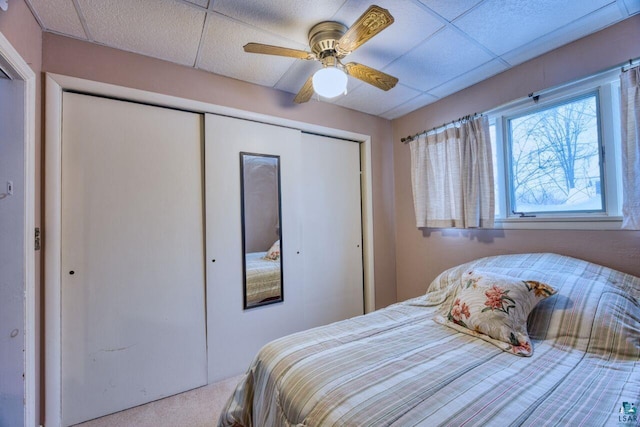 818 Douglas Ave, Eveleth, MN 55734 - bedroom featuring a closet, carpet floors, ceiling fan, and a paneled ceiling