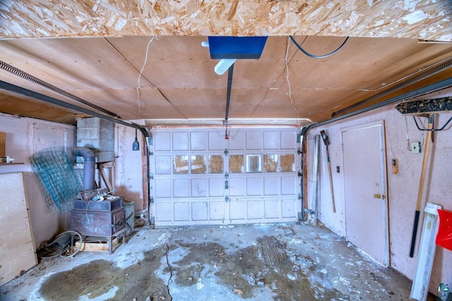 818 Douglas Ave, Eveleth, MN 55734 - garage featuring a wood stove