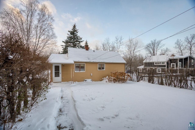 818 Douglas Ave, Eveleth, MN 55734 - snow covered house with a chimney