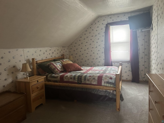 bedroom featuring carpet and vaulted ceiling