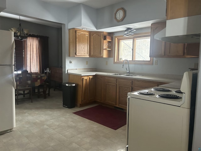 kitchen with white appliances, extractor fan, a notable chandelier, and sink