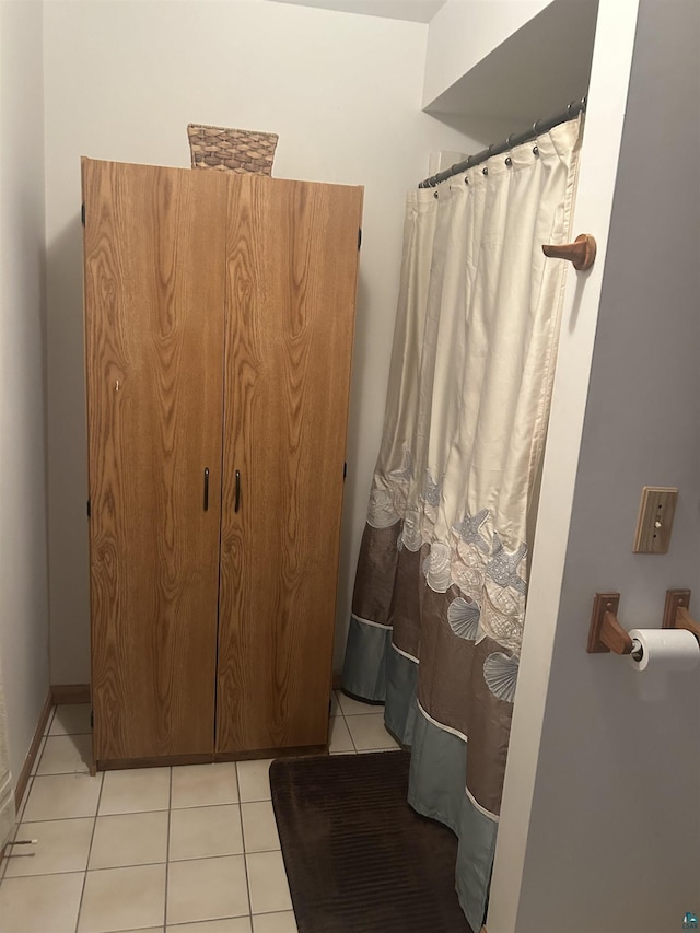 bathroom with tile patterned floors