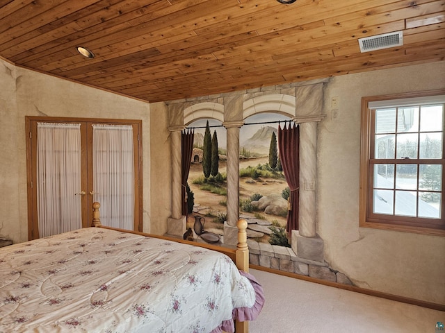 bedroom with lofted ceiling, wood ceiling, carpet floors, and french doors