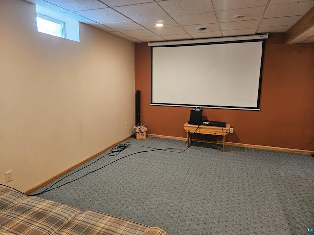 cinema featuring carpet flooring and a drop ceiling