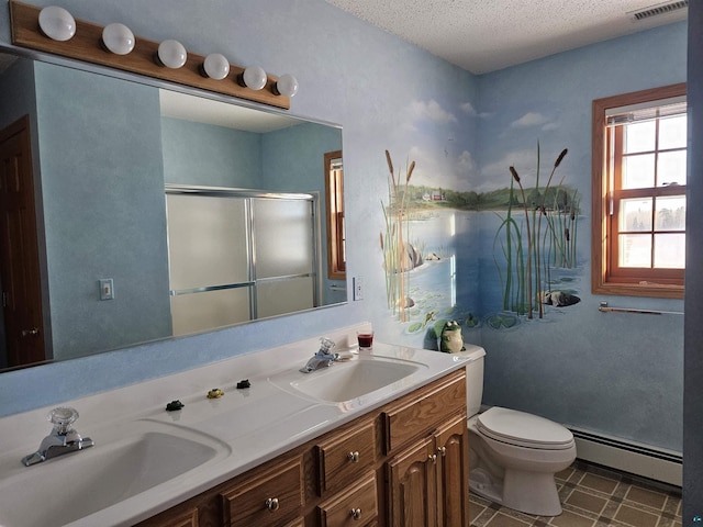 bathroom featuring a baseboard heating unit, an enclosed shower, toilet, a textured ceiling, and vanity