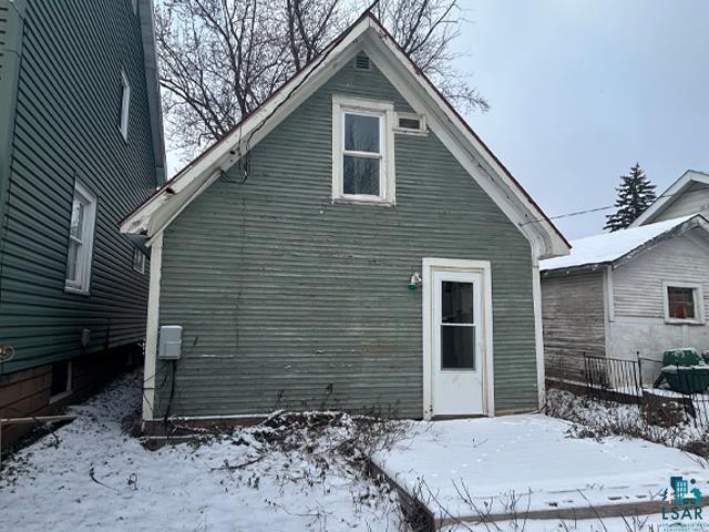 view of snow covered property