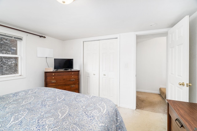 carpeted bedroom featuring a closet