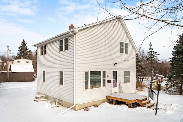 view of snow covered house