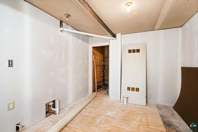 basement with a textured ceiling