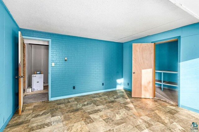 unfurnished bedroom featuring a textured ceiling