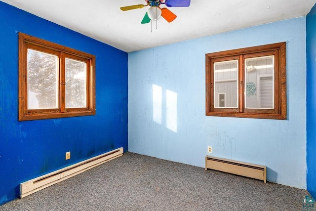 unfurnished room featuring carpet floors, baseboard heating, and ceiling fan