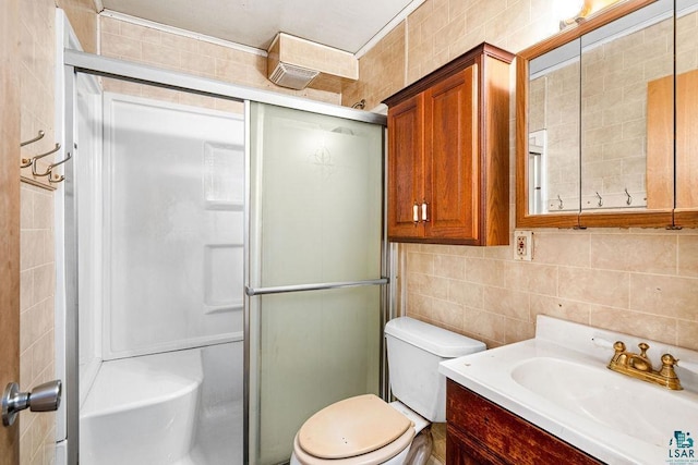 bathroom featuring walk in shower, backsplash, toilet, vanity, and tile walls