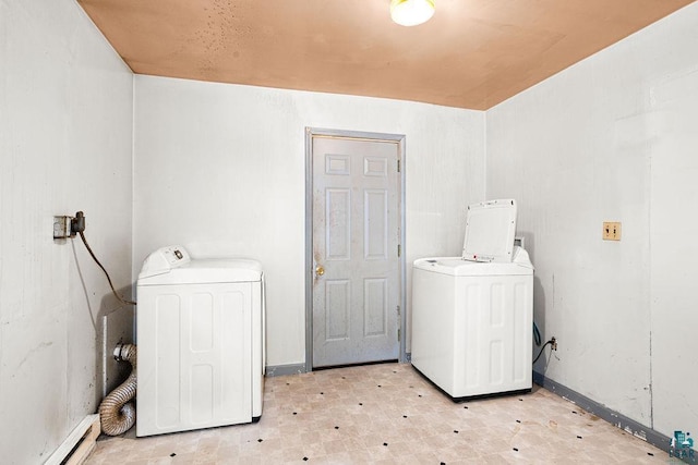 laundry room featuring washer and clothes dryer and a baseboard heating unit