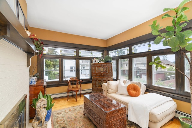 sunroom featuring baseboard heating