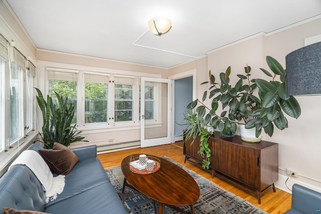 sunroom with baseboard heating and a wealth of natural light