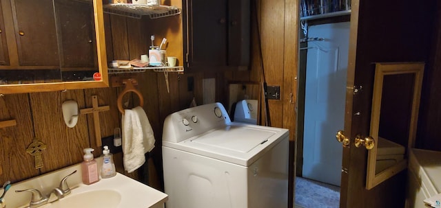 washroom with washer / clothes dryer and sink