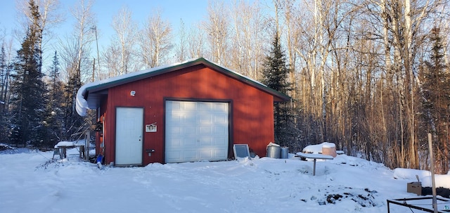 view of snow covered garage