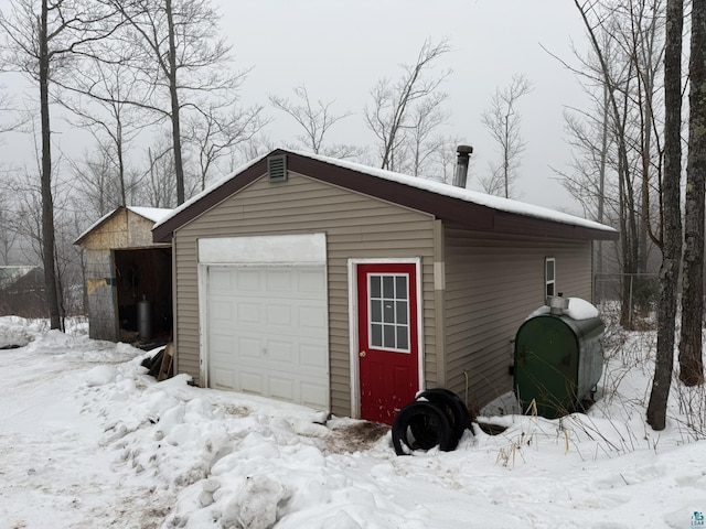 view of snow covered garage