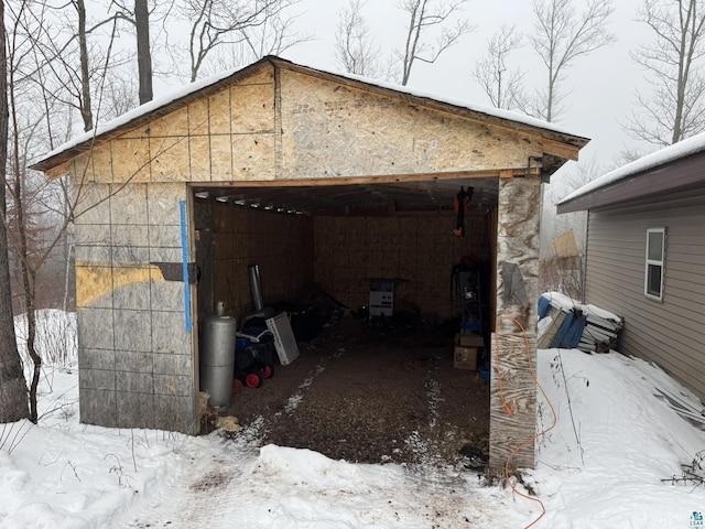 view of snow covered garage