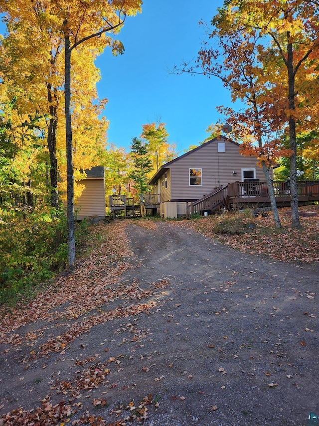 view of side of home featuring a deck