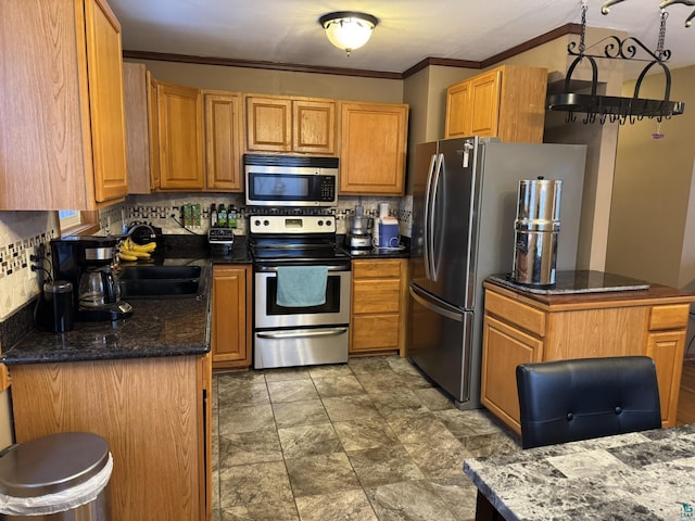 kitchen with stainless steel appliances, tasteful backsplash, and crown molding