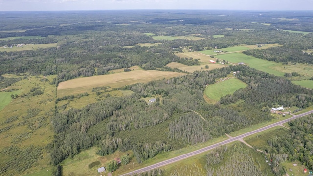 birds eye view of property with a rural view